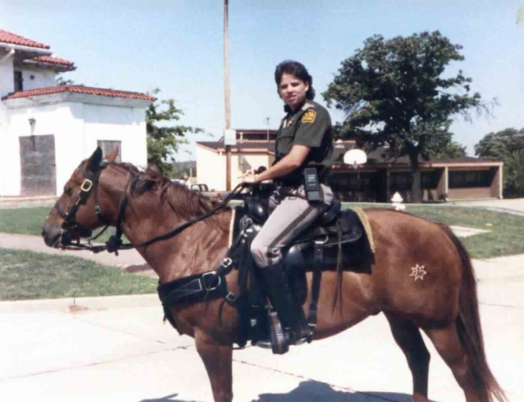 Mounted officer on a horse marked with the Tulsa Police star